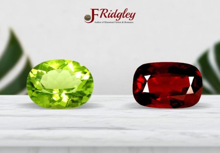 Green and red gemstones on marble surface.