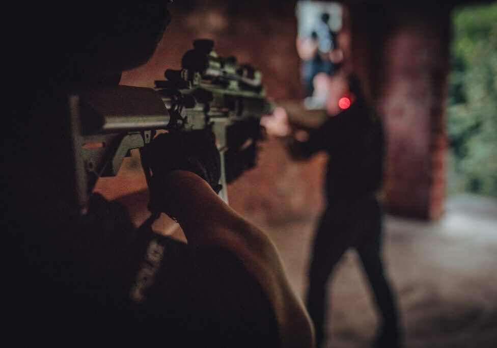 Police training exercise with firearms indoors.