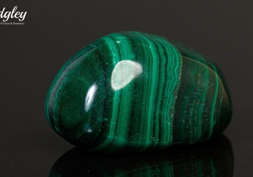 Green polished stone with striped patterns.