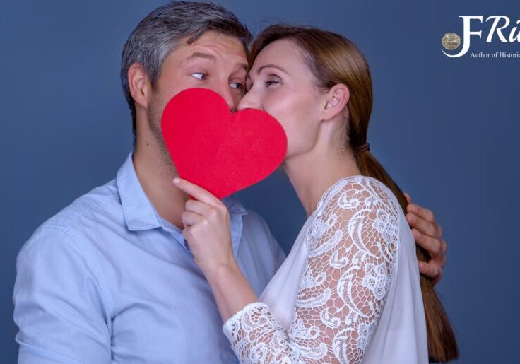 Couple sharing heart cutout, blue background.